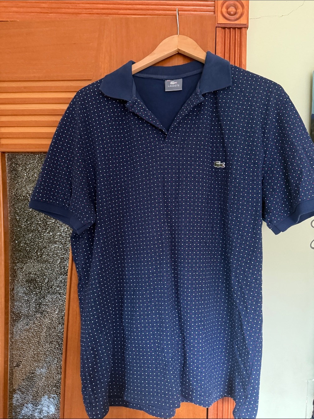 Lacoste Men's Navy Polo with White Micro Dot Pattern.It’s not too wide, like 2XL